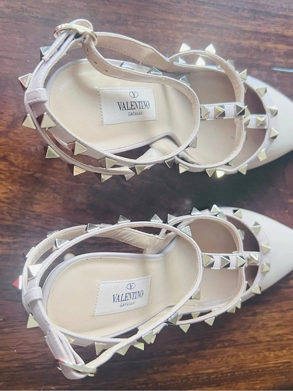 Valentino Garavani patent nappa leather pump feature iconic platinum-finish stud